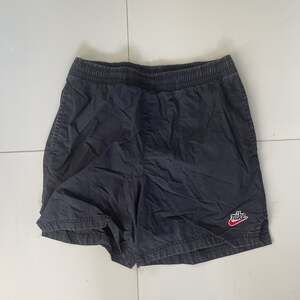 Vintage Nike Black Athletic Shorts with Embroidered Logo